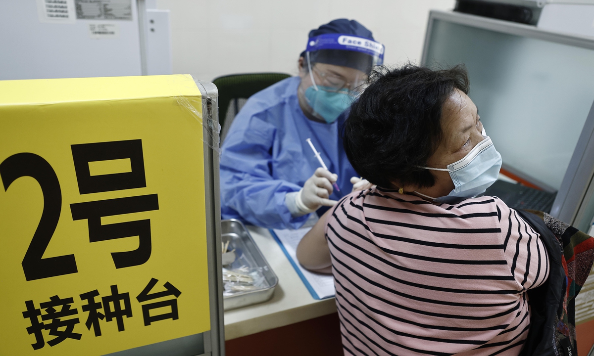 An elderly woman receives COVID-19 vaccine in April in Shanghai. Photo: VCG