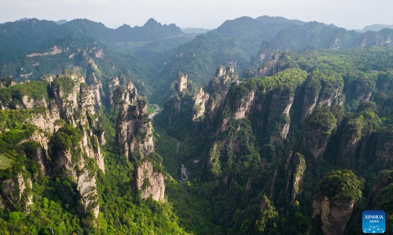 Aerial photo taken on April 19, 2022 shows a view of the Wulingyuan scenic area in Zhangjiajie, central China's Hunan Province. Wulingyuan, a UNESCO World Heritage Site, is noted for its unique quartzite sandstone pillars and peaks across most of the site.(Photo: Xinhua)