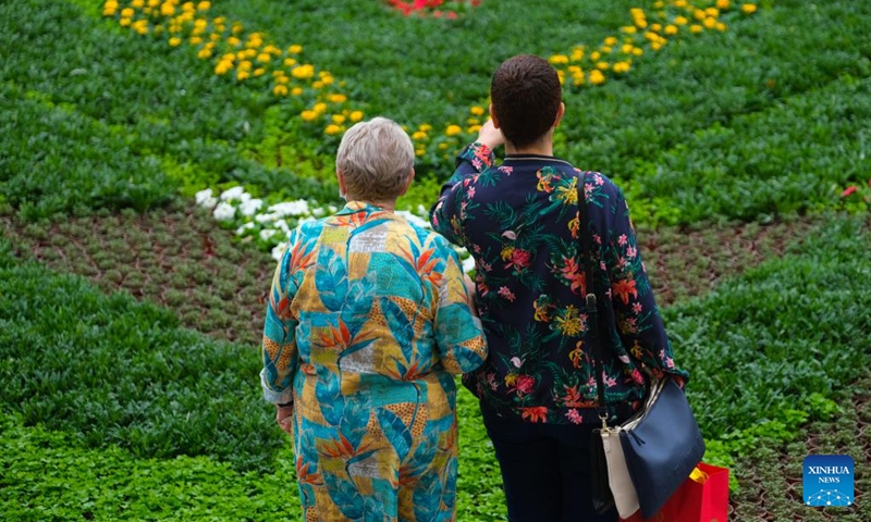 People visit St. George's Square with flowering display in Valletta, capital of Malta, on April 30, 2022. The ninth edition of the Valletta Green Festival takes place between April 28 and May 1 with this year's theme natural habitats. (Photo by Jonathan Borg/Xinhua)