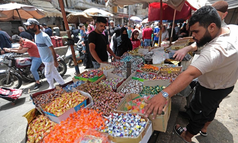 People buy candy ahead of Eid al-Fitr in Beirut, Lebanon, on April 30, 2022. (Xinhua/Bilal Jawich)