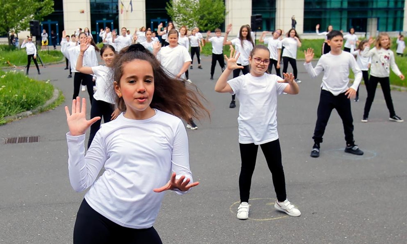 Children dance during an event marking the International Dance Day which falls on April 29 in Bucharest, capital of Romania, on April 30, 2022. (Photo by Cristian Cristel/Xinhua)