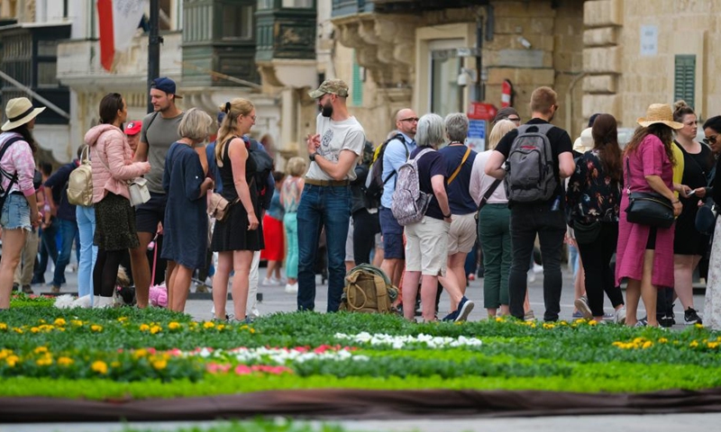 People visit St. George's Square with flowering display in Valletta, capital of Malta, on April 30, 2022. The ninth edition of the Valletta Green Festival takes place between April 28 and May 1 with this year's theme natural habitats. (Photo by Jonathan Borg/Xinhua)