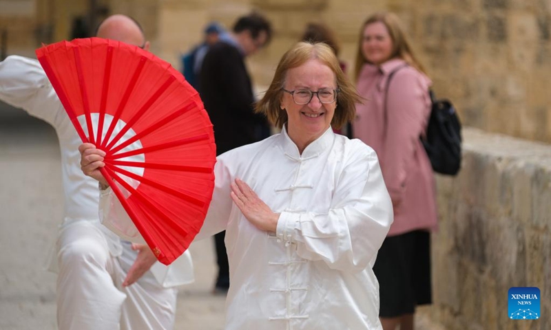 Taiji (Tai Chi) practitioners perform in Mdina, Malta, on April 30, 2022. Taiji (Tai Chi) practitioners in Malta marked World Taiji Day on Saturday with the first-ever relay flash mob at Malta's most iconic sites. (Photo by Jonathan Borg/Xinhua)