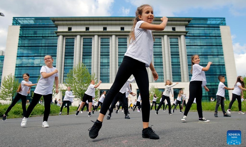 Children dance during an event marking the International Dance Day which falls on April 29 in Bucharest, capital of Romania, on April 30, 2022. (Photo by Cristian Cristel/Xinhua)