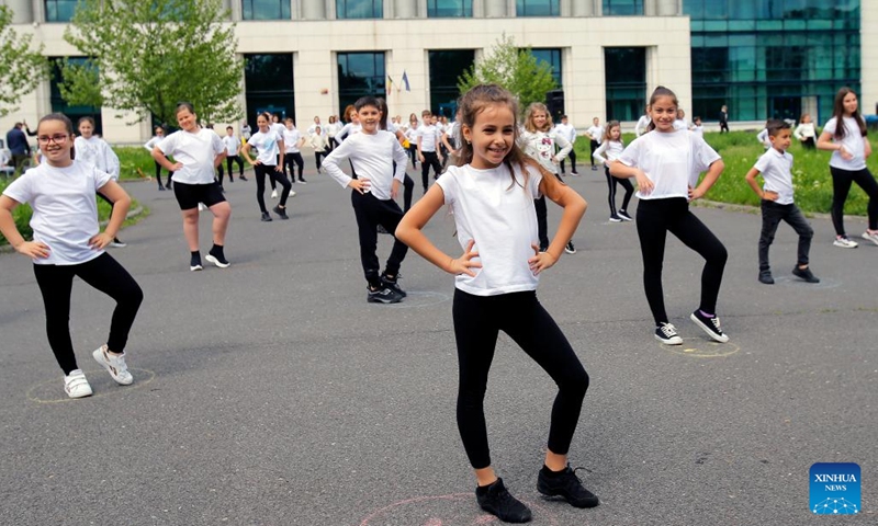 Children dance during an event marking the International Dance Day which falls on April 29 in Bucharest, capital of Romania, on April 30, 2022. (Photo by Cristian Cristel/Xinhua)