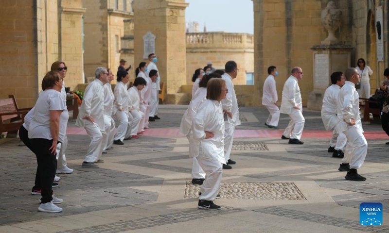 Taiji (Tai Chi) practitioners perform in Valletta, capital of Malta, on April 30, 2022. Taiji (Tai Chi) practitioners in Malta marked World Taiji Day on Saturday with the first-ever relay flash mob at Malta's most iconic sites. (Photo by Jonathan Borg/Xinhua)