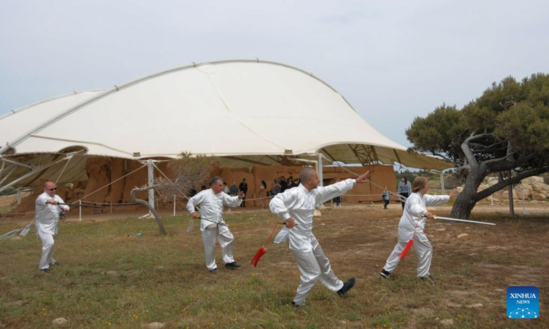 Taiji (Tai Chi) practitioners perform in Hagar Qim Temple, Malta, on April 30, 2022. Taiji (Tai Chi) practitioners in Malta marked World Taiji Day on Saturday with the first-ever relay flash mob at Malta's most iconic sites. (Xinhua/Chen Wenxian)