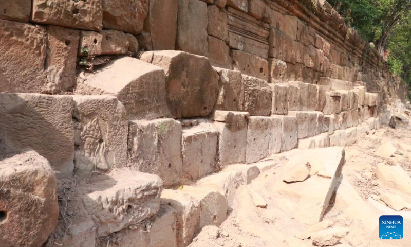Undated photo shows an Apsara carving found recently at the causeway of the Angkor Thom temple's Takav Gate in the Angkor Archaeological Park in Siem Reap province, Cambodia. Archaeologists have discovered pieces of the 12th century Apsara, or fairy carvings, in the Angkor Archaeological Park in northwest Cambodia's Siem Reap province, the APSARA National Authority (ANA) said in a statement on May 2, 2022. (ANA/Handout via Xinhua)