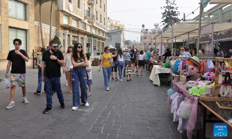 People visit a spring fair in Batroun, northern Lebanon, on April 30, 2022.Photo:Xinhua