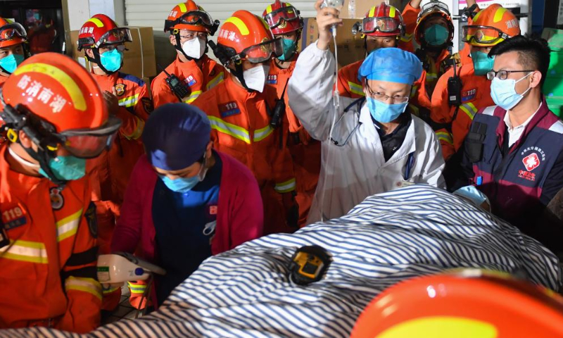 Rescuers transfer the ninth survivor who has been pulled from the rubble 88 hours after a self-built residential building collapsed in Changsha, central China's Hunan Province, May 3, 2022. A self-constructed residential building collapsed on April 29 in Wangcheng District in Changsha. (Xinhua/Chen Zeguo)