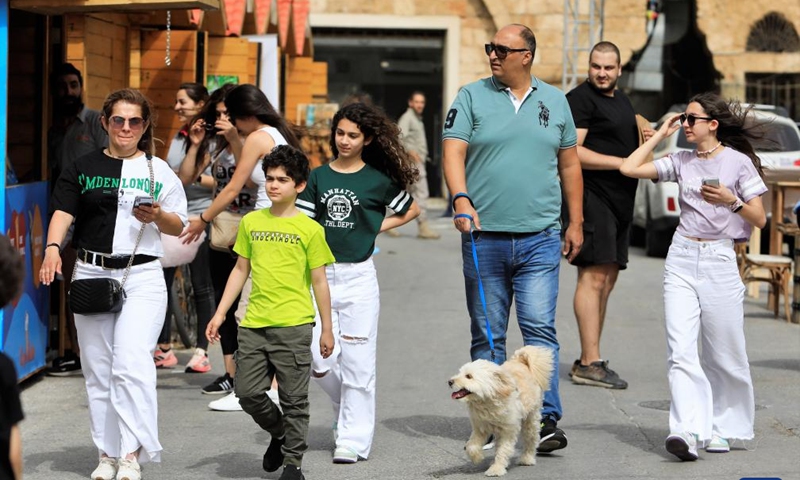 People visit a spring fair in Batroun, northern Lebanon, on April 30, 2022.Photo:Xinhua