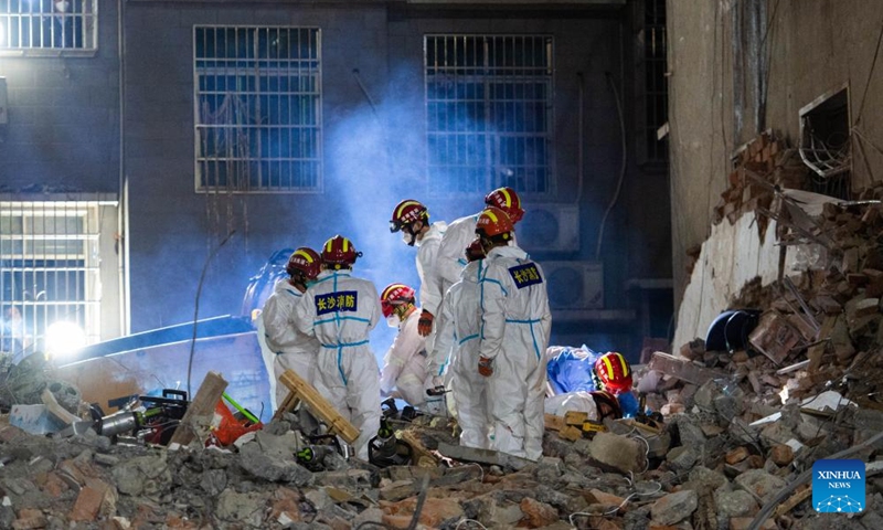 The tenth survivor is rescued from the debris about 132 hours after a self-built residential structure collapsed in Changsha, central China's Hunan Province, at around 12:00 a.m. May 5, 2022. Ten people have been rescued and five others died after a self-built residential structure collapsed in central China's Hunan Province on April 29, rescuers said early Thursday. (Xinhua)