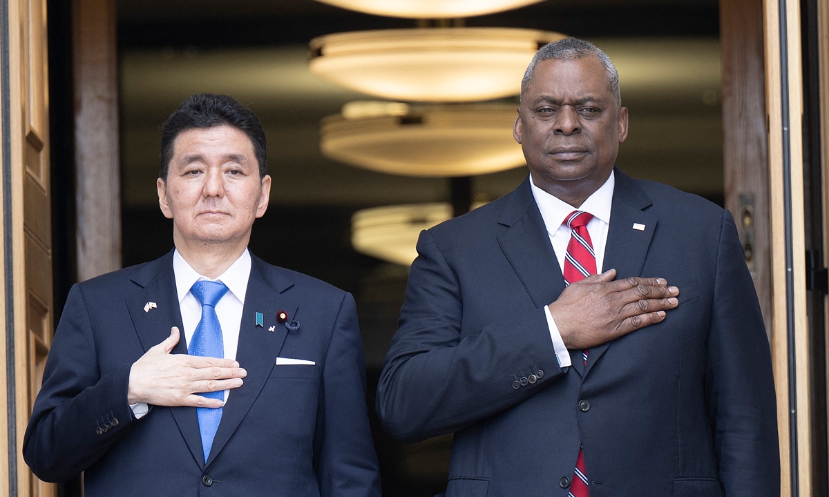 Japan's Defense Minister Nobuo Kishi and US Secretary of Defense Lloyd Austin listen to the US national anthem during an honor cordon at the Pentagon May 4, 2022, in Washington, DC.Photo: AFP