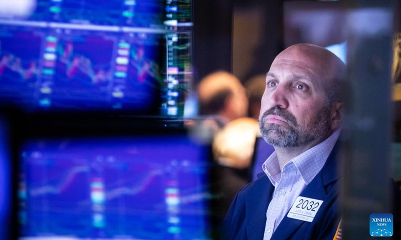 A trader works on the floor of the New York Stock Exchange (NYSE) in New York, the United States, May 5, 2022. U.S. stocks plunged on Thursday as heavy selling intensified on Wall Street. The Dow Jones Industrial Average tumbled 1063.09 points, or 3.12 percent, to 32,997.97. The S&P 500 fell 153.30 points, or 3.56 percent, to 4,146.87. The Nasdaq Composite Index shed 647.17 points, or 4.99 percent, to 12,317.69. (Photo by Michael Nagle/Xinhua)