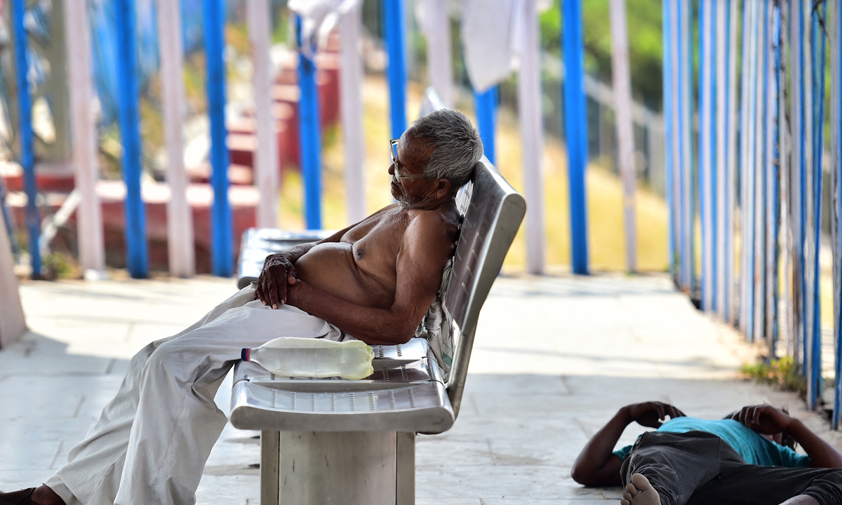 Men rest on a platform at the Daraganj railway station on a hot summer day in Allahabad, India on May 6, 2022. India is experiencing an unprecedented heat wave in more than a century and the maximum temperature in the capital of New Delhi hovered around 40 degrees Celsius on Friday. The heat wave has resulted in extreme electricity shortage. 
Photo: AFP