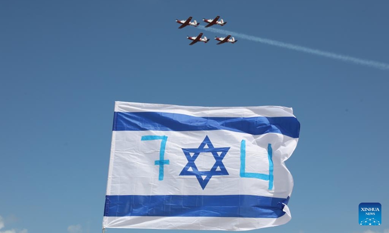 Israeli Air Force aircraft perform during an air show celebrating Israel's 74th Independence Day in Tel Aviv, Israel, on May 5, 2022. Israelis joined a slew of national celebrations to mark the country's 74th Independence Day. This year's Independent Day began on Wednesday evening and will last till Thursday evening.(Photo: Xinhua)