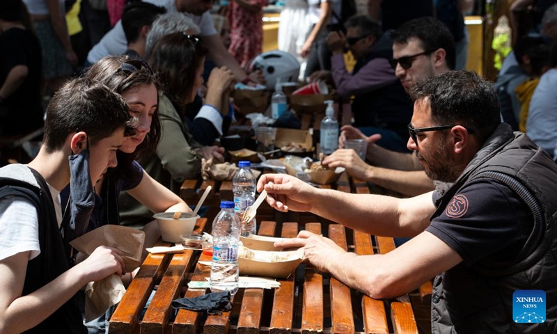 People take part in the Athens Street Food Festival in Athens, Greece, on May 7, 2022.Photo:Xinhua