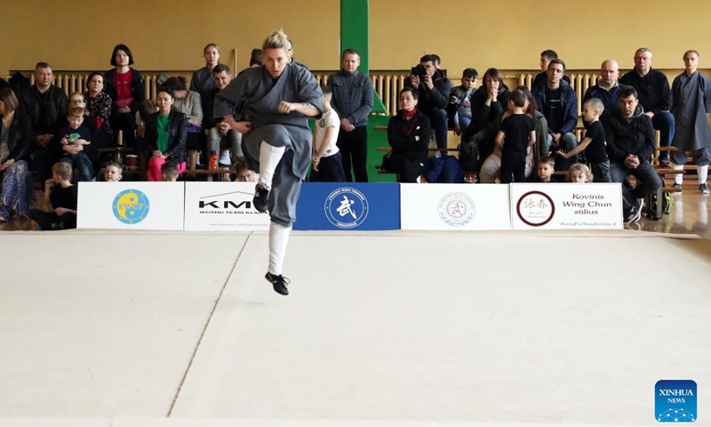 An athlete competes at the Vilnius Open Wushu Cup in Vilnius, Lithuania, on May 7, 2022. The Vilnius Open Wushu Cup opened on Saturday, drawing more than 50 students from local wushu clubs. (Xinhua)
