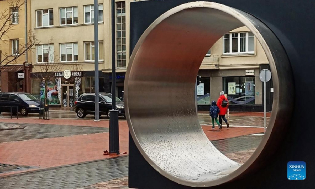 Citizens walk on the street in Siauliai, Lithuania. Photo: Xinhua