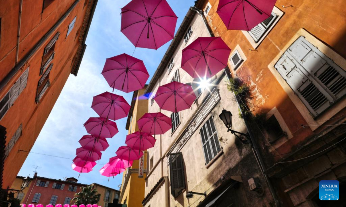 A street is decorated with pink umbrellas during the 50th ExpoRose in Grasse, southern France, on May 13, 2022. The city center of Grasse was turned into rose gardens during the three-day ExpoRose festival which kicked off here on Friday. Photo:Xinhua