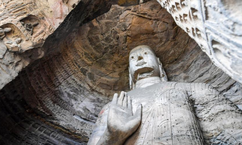 A Buddha statue is pictured at the Yungang Grottoes in Datong, north China's Shanxi Province, May 11, 2022.

With 45 major caves and more than 51,000 statues, the 1,500-year-old Yungang Grottoes were listed as a UNESCO World Heritage Site in 2001. (Xinhua/Cao Yang)