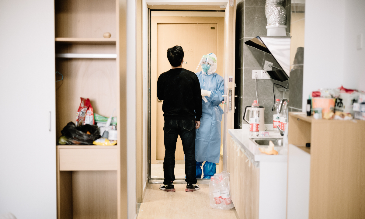 A patient takes nucleic acid test at a makeshift hospital in Shanghai. Photo: VCG