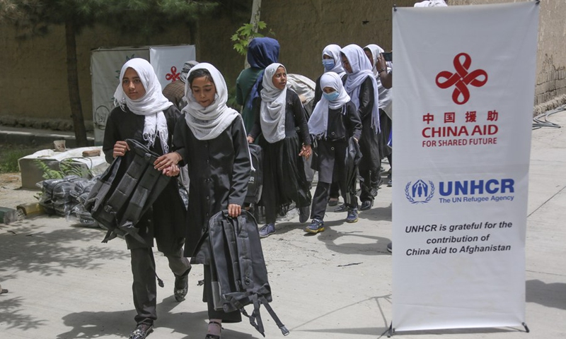Afghan school children receive backpacks provided by China's South-South Cooperation Assistance Fund in cooperation with the United Nations Refugee Agency (UNHCR) in Kabul, Afghanistan, May 9, 2022. (Photo: Xinhua)