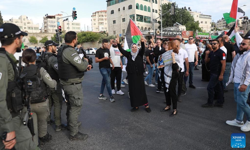 Palestinian people protest against the killing of Al-Jazeera journalist Shireen Abu Akleh in Jerusalem, on May 11, 2022. The killing of Al-Jazeera journalist Shireen Abu Akleh in the occupied West Bank on Wednesday morning sparked condemnation and outrage among the Palestinians.(Photo: Xinhua)