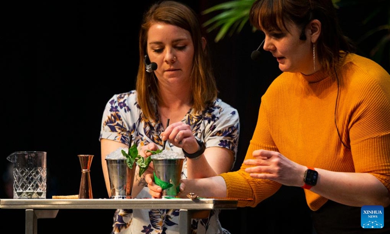 Bartenders compete during the Beyond The Rail Cocktail Competition at the 2022 Restaurants Canada Show in Toronto, Canada, on May 10, 2022. Six teams of Canada's top bartenders took part in this battle of bars to shake, sling and stir their finest cocktail creations here on Tuesday.(Photo: Xinhua)