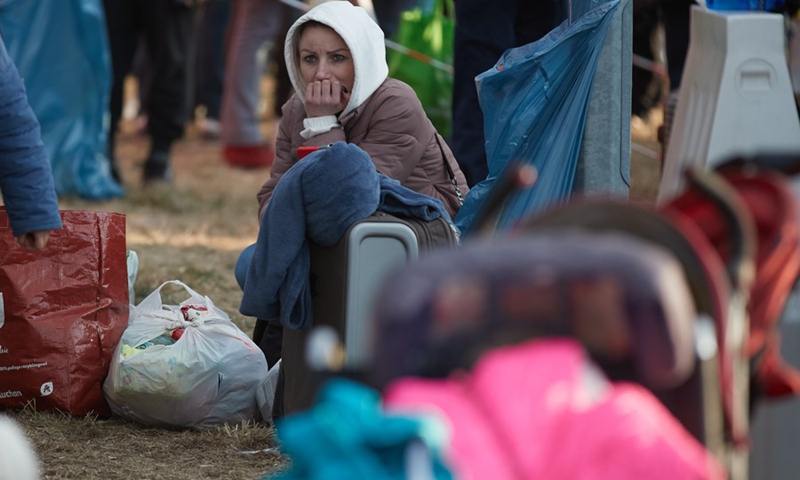 People from Ukraine rest at a temporary resettlement site in Przemysl, Poland, Feb. 26, 2022.(Photo: Xinhua)