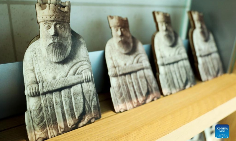 Photo taken on May 11, 2022 shows the Lewis Chessmen postcards in the British Museum in London, Britain. The Lewis Chessmen are among the most popular collections in the British Museum. Discovered on the Isle of Lewis of Scotland in 1831, the medieval chess pieces were made of walrus ivory.(Photo: Xinhua)
