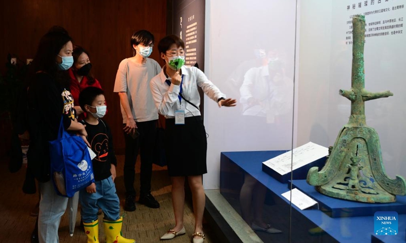 Visitors view an exhibit at an exhibition named Share the Same River: Bronze Age Civilization in the Yangtze River Valley at Fujian Museum in Fuzhou City, southeast China's Fujian Province, May 12, 2022.(Photo: Xinhua)