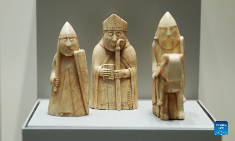 Photo taken on May 11, 2022 shows the Lewis Chessmen in the British Museum in London, Britain. The Lewis Chessmen are among the most popular collections in the British Museum. Discovered on the Isle of Lewis of Scotland in 1831, the medieval chess pieces were made of walrus ivory.(Photo: Xinhua)