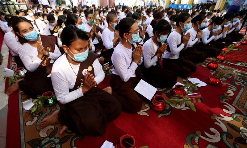 Buddhist female chanting groups participate in the Bodhi Tree Watering Festival at the Shwedagon Pagoda in Yangon, Myanmar, May 14, 2022.Photo:Xinhua