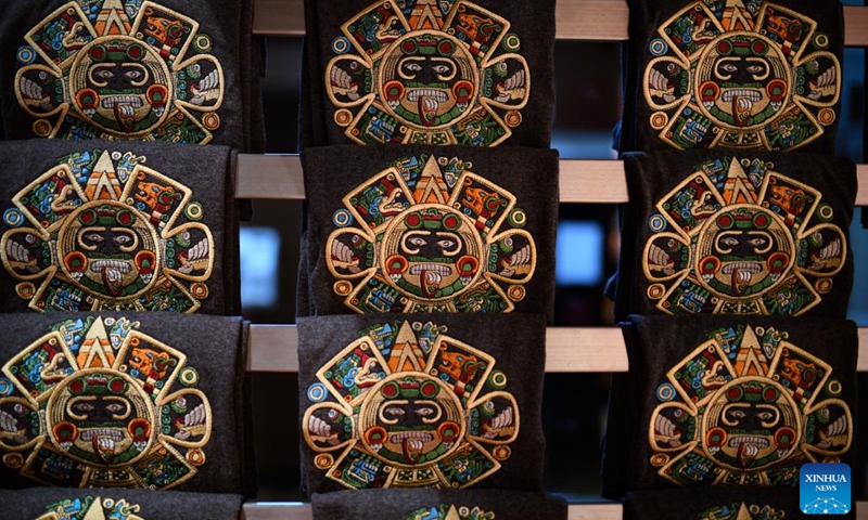 Photo taken on May 10, 2022 shows souvenirs featuring the Stone of the Sun at the National Museum of Anthropology in Mexico City, Mexico. The Stone of the Sun highlights the Sun's role in Aztec belief and religion. (Xinhua/Xin Yuewei)