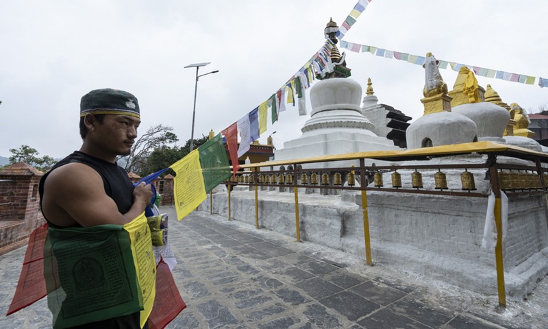 Butter lamps and prayer flags are offered in Namo Buddha in Kavre, Nepal, on May 15, 2022, to mark the Day of Vesak.Photo:Xinhua