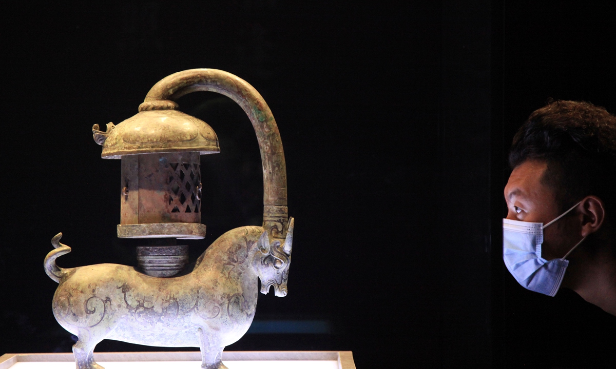 A man visits a cultural relic from Han Dynasty (206BC-AD220) displayed at Nanjing Museum in East China's Jiangsu Province on May 15. 
Photos: VCG
