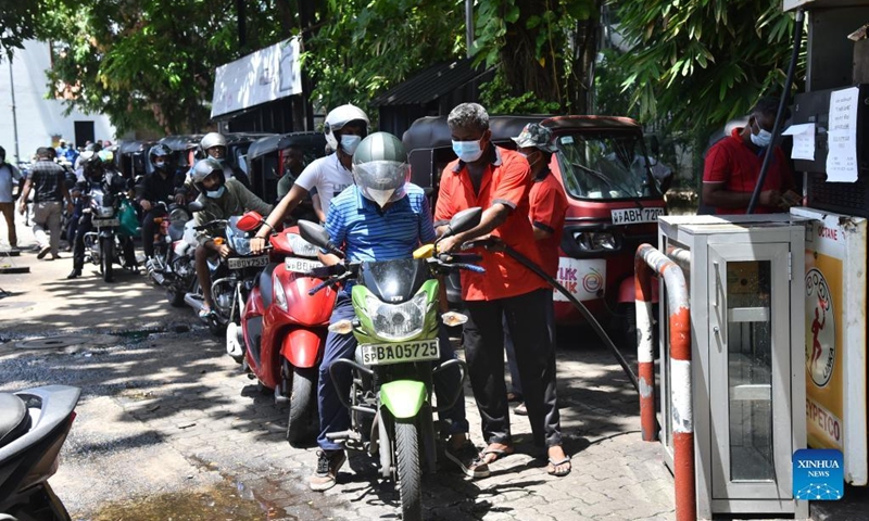 Motorbike drivers wait in line for a fill-up at a gas station in Colombo, Sri lanka, on May 16, 2022. Sri Lankan Minister of Power and Energy Kanchana Wijesekera on Monday assured the public of adequate fuel in the country soon. Sri Lanka has been facing a severe fuel shortage, triggering almost daily power cuts in the past few months.(Photo: Xinhua)