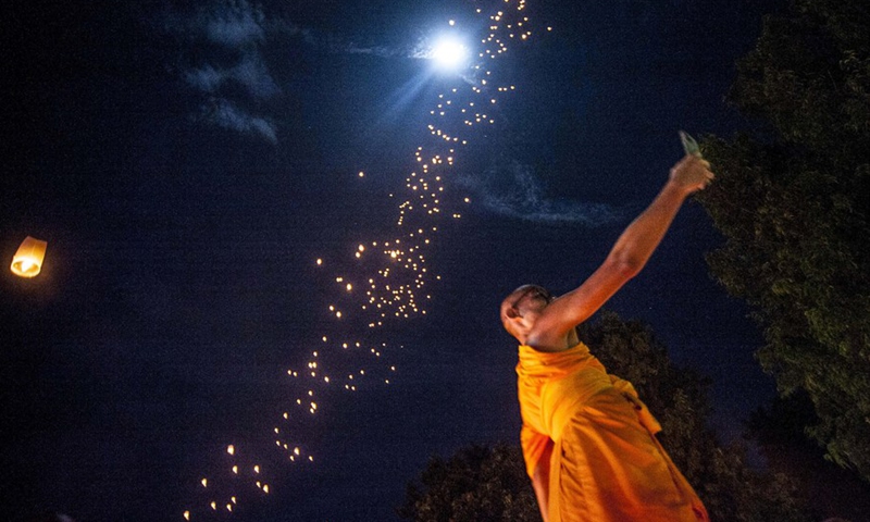 A Buddhist monk takes a selfie after flying lanterns during a ceremony to celebrate Vesak Day at Borobudur temple in Magelang, Central Java, Indonesia, May 16, 2022. (Photo: Xinhua)