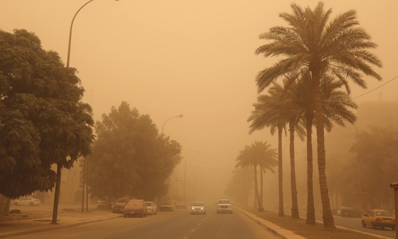 A dust storm hits Baghdad, Iraq, on May 16, 2022. A dust storm swept across much of Iraq on Monday, sending more than 2,000 people to hospitals with respiratory problems and forcing the closure of airports, schools and some government offices.(Photo: Xinhua)