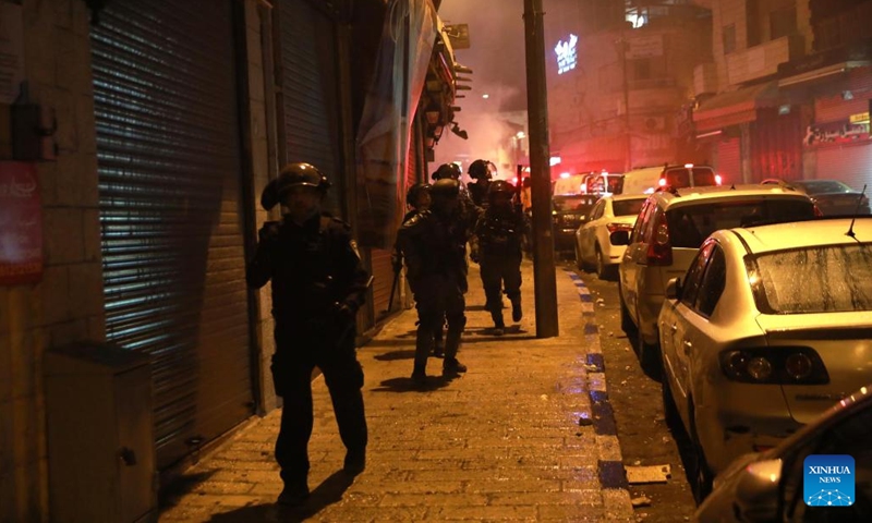 Israeli police patrol during clashes with Palestinians in Jerusalem on May 16, 2022. Clashes erupted between Palestinians and Israeli police in East Jerusalem on Monday night as thousands gathered for the funeral of a young Palestinian who died after being injured in clashes with police in April.(Photo: Xinhua)