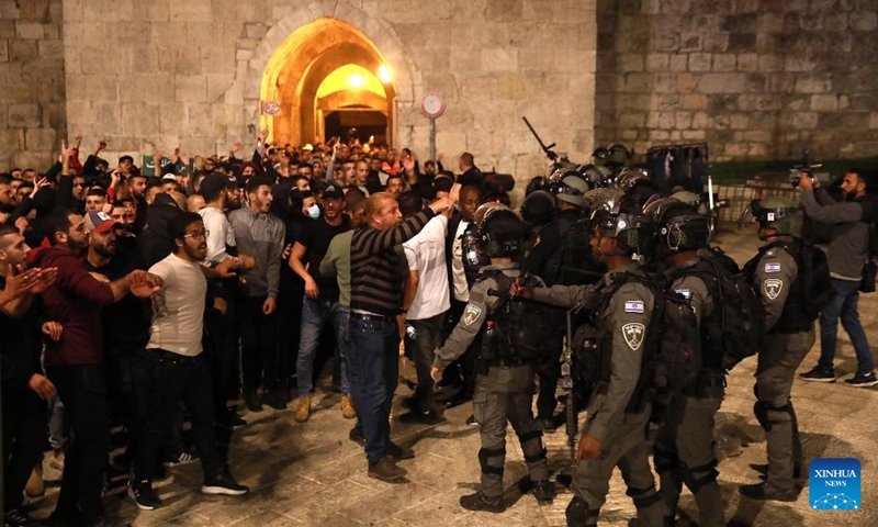 Israeli police patrol during clashes with Palestinians in Jerusalem on May 16, 2022. Clashes erupted between Palestinians and Israeli police in East Jerusalem on Monday night as thousands gathered for the funeral of a young Palestinian who died after being injured in clashes with police in April.(Photo: Xinhua)