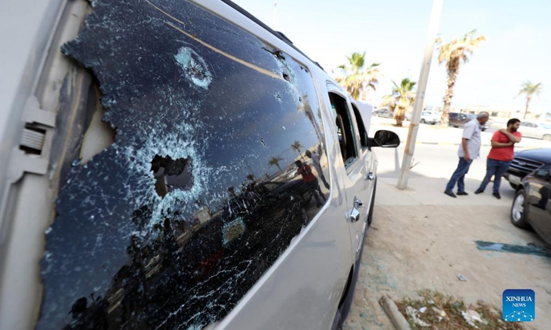 Damaged cars are seen after clashes in the capital Tripoli, Libya, May 17, 2022. Clashes erupted in different parts of Libya's capital Tripoli on Tuesday after the parliament-approved government, headed by Fathi Bashagha, entered the city, forcing the new prime minister to leave the capital just hours after arrival.(Photo: Xinhua)