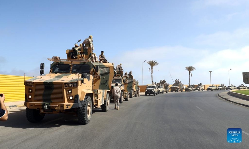 Army forces gather in Tripoli, Libya, May 17, 2022. Clashes erupted in different parts of Libya's capital Tripoli on Tuesday after the parliament-approved government, headed by Fathi Bashagha, entered the city, forcing the new prime minister to leave the capital just hours after arrival.(Photo: Xinhua)