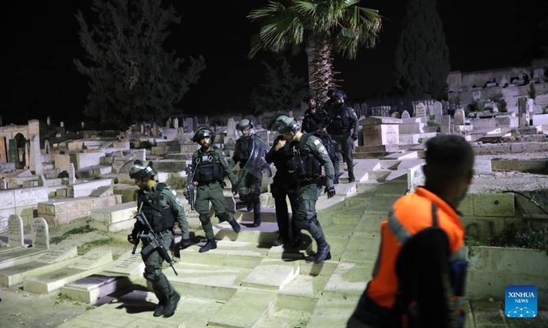 Israeli police patrol during clashes with Palestinians in Jerusalem on May 16, 2022. Clashes erupted between Palestinians and Israeli police in East Jerusalem on Monday night as thousands gathered for the funeral of a young Palestinian who died after being injured in clashes with police in April.(Photo: Xinhua)