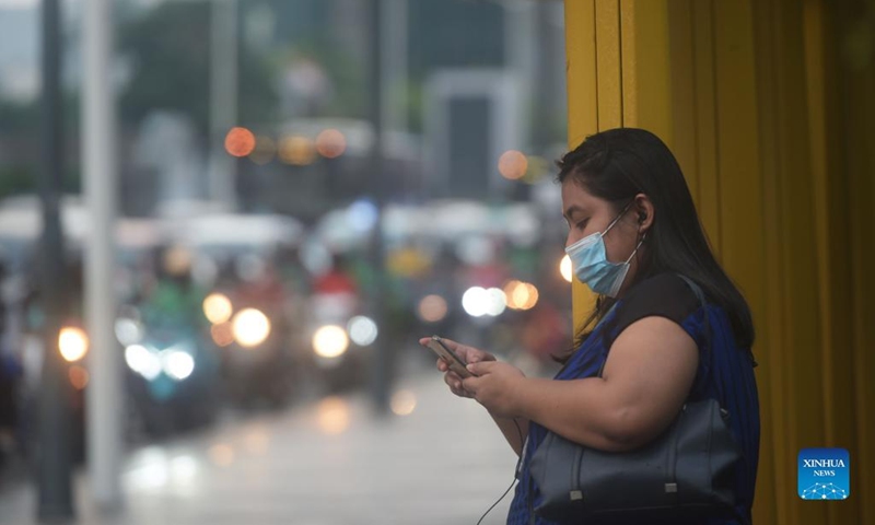 A woman wearing a face mask is seen during rush hour in Jakarta, Indonesia, May 17, 2022. Indonesian government eased mask mandatary rules in outdoor places on Tuesday.(Photo: Xinhua)