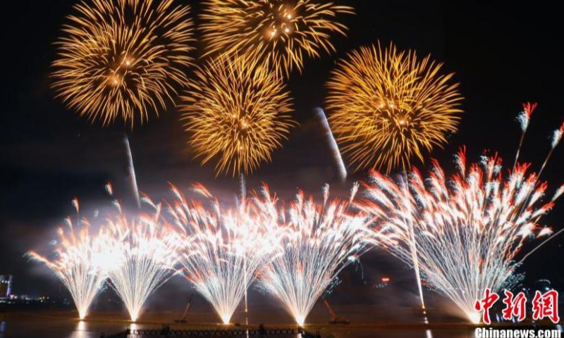Fireworks illuminate the night sky during a commemorative event on the 1,401 birth anniversary of Li Tian, the founder of firecrackers in Shangli county, Pingxiang, Jiangxi Province, May 18, 2022. Having a history of fireworks production of more than 1,300 years , Shangli County of Jiangxi is regarded as the birthplace of China’s fireworks and crackers. (Photo: China News Service/Liu Yunchi)