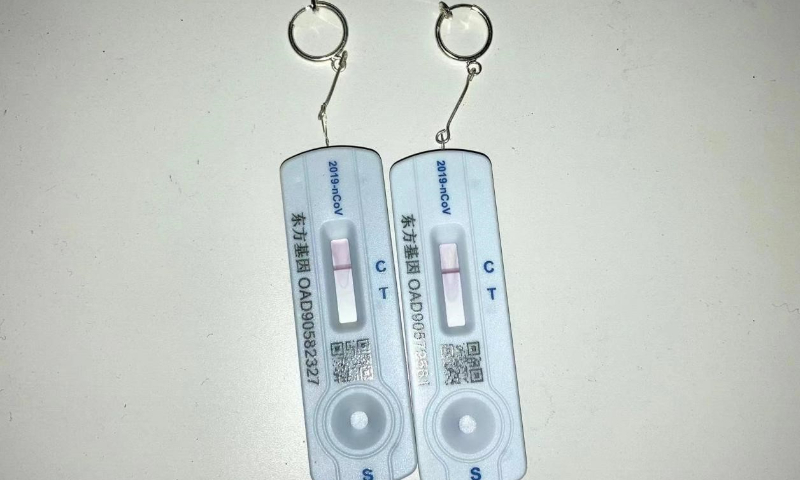 Earrings made by Huang during home quarantine using antigen self-test kits. Photo: Courtesy of Huang