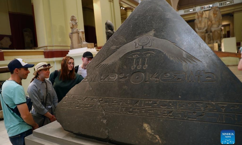 Tourists visit an exhibit during the International Museum Day at the Egyptian Museum in Cairo, Egypt, on May 18, 2022. The Egyptian Museum on Wednesday organized a number of free tour guides for visitors of all ages on the International Museum Day, which annually falls on May 18.(Photo: Xinhua)