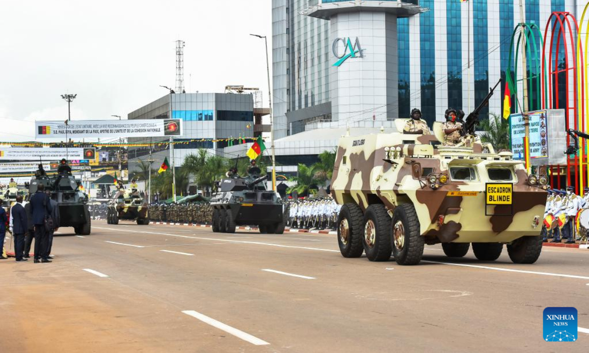 Military vehicles are driven during a parade to celebrate the National Day in Yaounde, Cameroon, on May 20, 2022. Cameroon marked on Friday the 50th anniversary of its National Day with a military and civilian parade for the first time since the first case of coronavirus was detected in the Central African nation in March 2020. Photo:Xinhua